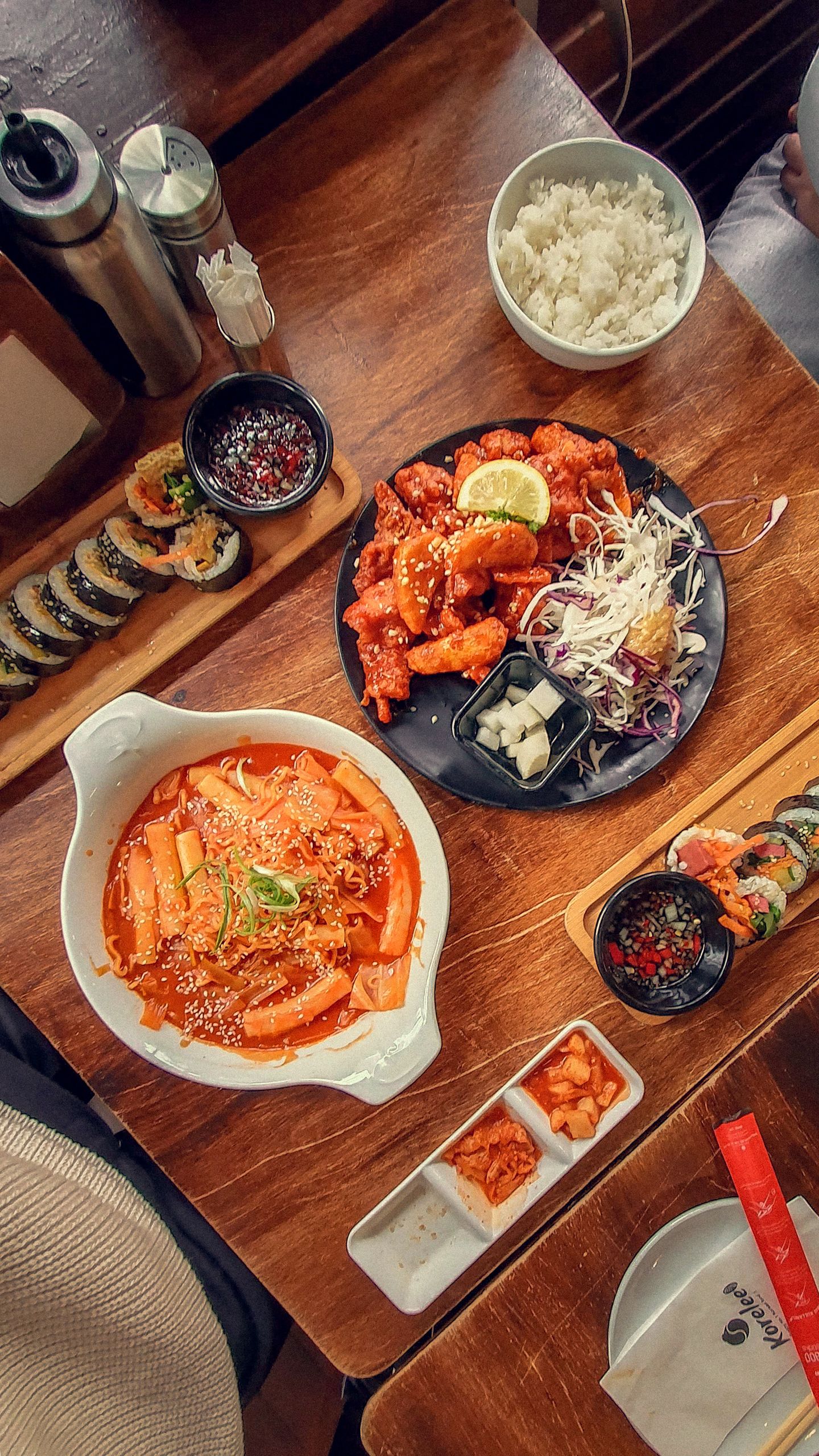 4 Korean Convenience Store Combos to Make at Home (Banana Latte, Cheese Rabokki & More) 1 Korean convenience store combos at home - kimbap and cheese rabokki on table